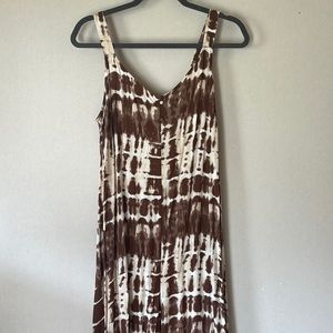 Long ruffle pant romper. Color is brown, tan, ivory. Size Small. Wide leg.